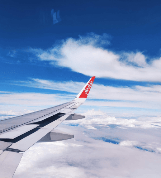 AirAsia Flight Soaring Above Tropical Cloudscape